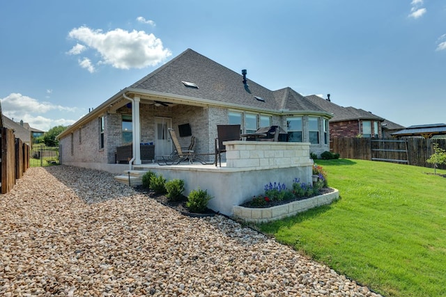 22208 Coyote Cave Trl, Spicewood, TX 78669 - rear view of property with brick siding, ceiling fan, a patio area, and roof with shingles