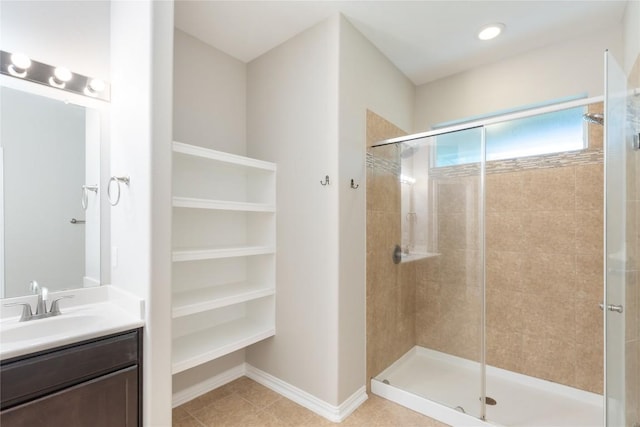 217 Orchard Hill Trl, Buda, TX 78610 - bathroom featuring a stall shower, vanity, and tile patterned floors