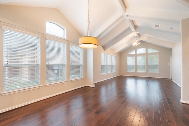 217 Orchard Hill Trl, Buda, TX 78610 - unfurnished living room featuring vaulted ceiling, ceiling fan, dark wood-type flooring, and baseboards