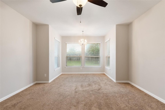217 Orchard Hill Trl, Buda, TX 78610 - carpeted empty room with a chandelier, ceiling fan, and baseboards