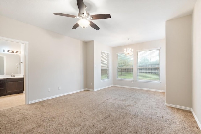 217 Orchard Hill Trl, Buda, TX 78610 - unfurnished room with a chandelier, a ceiling fan, and light colored carpet