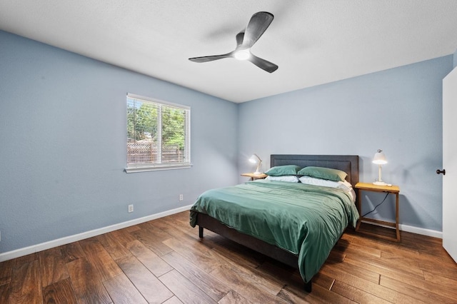 6725 Broad Brook Dr, Austin, TX 78747 - bedroom featuring wood-type flooring, baseboards, and a ceiling fan