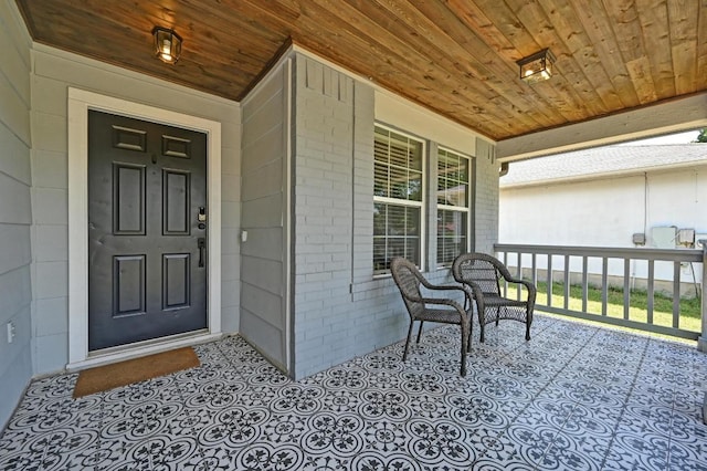 6725 Broad Brook Dr, Austin, TX 78747 - view of exterior entry featuring covered porch and brick siding