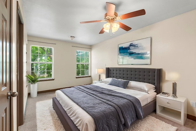 1203 Haynes St, San Marcos, TX 78666 - carpeted bedroom with baseboards and ceiling fan