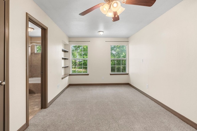 1203 Haynes St, San Marcos, TX 78666 - empty room with light carpet, ceiling fan, and built in features