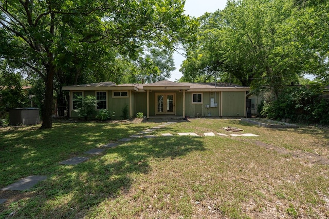 1203 Haynes St, San Marcos, TX 78666 - back of house featuring french doors and a lawn