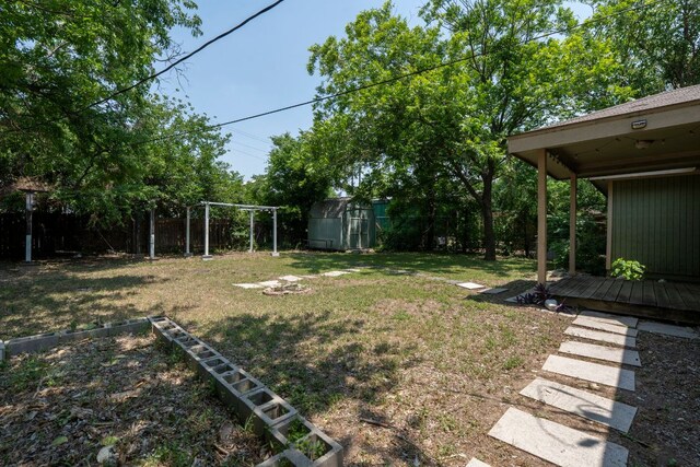 1203 Haynes St, San Marcos, TX 78666 - fenced yard featuring a storage shed