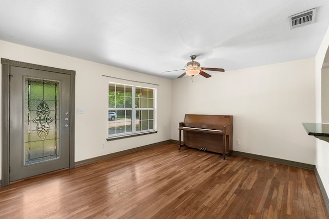 1203 Haynes St, San Marcos, TX 78666 - unfurnished living room featuring wood finished floors and a ceiling fan