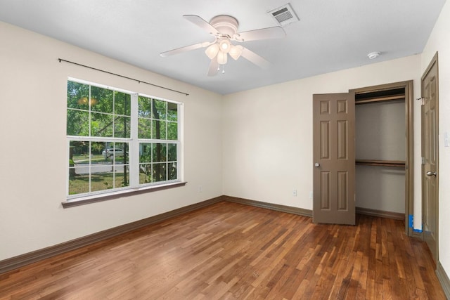 1203 Haynes St, San Marcos, TX 78666 - unfurnished bedroom featuring wood finished floors, a closet, and ceiling fan