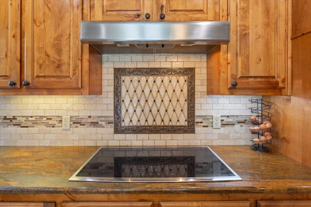 2901 Olympia Dr, Temple, TX 76502 - kitchen featuring under cabinet range hood, black electric cooktop, backsplash, and brown cabinets