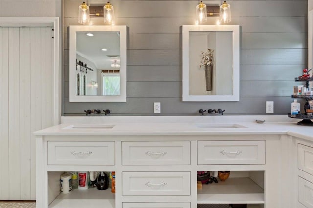 2901 Olympia Dr, Temple, TX 76502 - bathroom featuring wood walls and double vanity