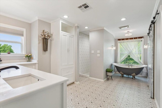 2901 Olympia Dr, Temple, TX 76502 - full bathroom with tiled shower, crown molding, a freestanding tub, baseboards, and vanity