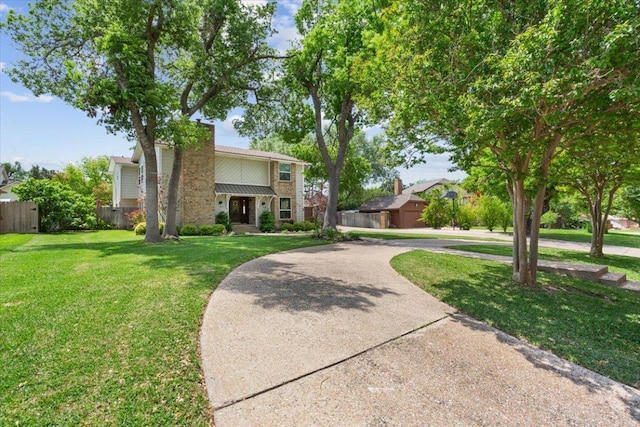 2901 Olympia Dr, Temple, TX 76502 - view of front facade featuring stone siding, curved driveway, and a chimney
