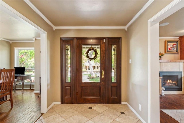 2901 Olympia Dr, Temple, TX 76502 - entryway featuring baseboards, crown molding, and a fireplace