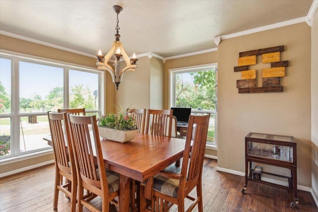 2901 Olympia Dr, Temple, TX 76502 - dining area with a chandelier, hardwood / wood-style flooring, baseboards, and ornamental molding