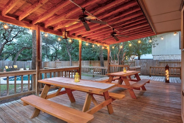1303 Shady Grove Path, Cedar Park, TX 78613 - wooden terrace featuring a ceiling fan, outdoor dining area, and a fenced backyard