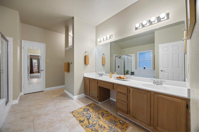 1303 Shady Grove Path, Cedar Park, TX 78613 - full bath with double vanity, a shower stall, tile patterned floors, and baseboards