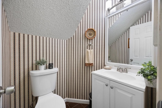 1303 Shady Grove Path, Cedar Park, TX 78613 - bathroom featuring wallpapered walls, vanity, toilet, lofted ceiling, and baseboards