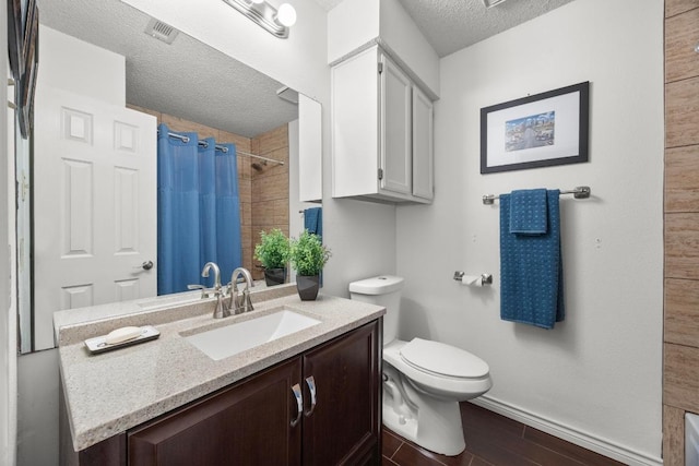bathroom featuring a textured ceiling, toilet, wood finished floors, curtained shower, and vanity