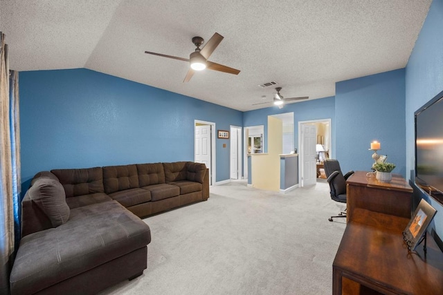 1303 Shady Grove Path, Cedar Park, TX 78613 - living room with a ceiling fan, a textured ceiling, carpet floors, a desk, and lofted ceiling
