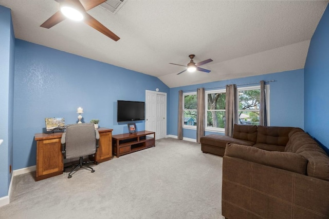 1303 Shady Grove Path, Cedar Park, TX 78613 - living room with a ceiling fan, vaulted ceiling, a desk, light carpet, and baseboards