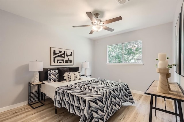 bedroom featuring light wood finished floors and ceiling fan