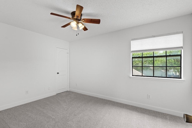 11708 Rotherham Dr, Austin, TX 78753 - empty room featuring carpet floors, a ceiling fan, and a textured ceiling