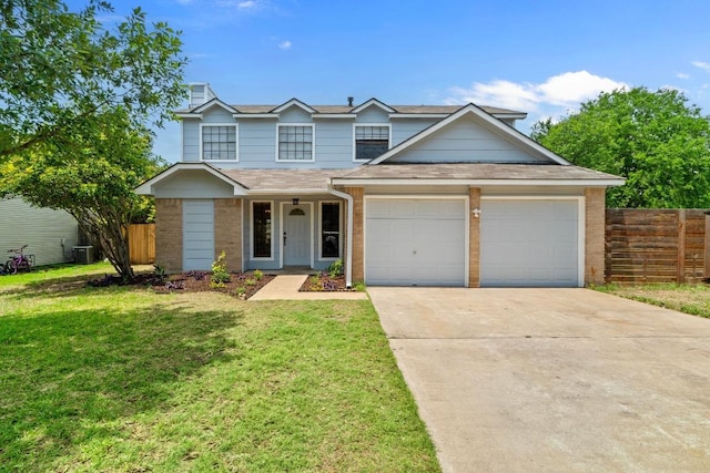 11708 Rotherham Dr, Austin, TX 78753 - traditional home featuring a garage, concrete driveway, brick siding, and a shingled roof