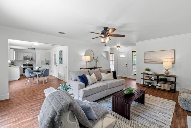 11708 Rotherham Dr, Austin, TX 78753 - living area with a ceiling fan, ornamental molding, and wood finished floors