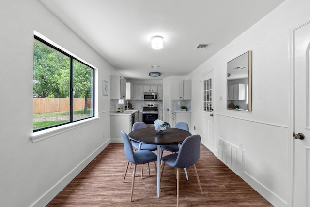 11708 Rotherham Dr, Austin, TX 78753 - dining area featuring dark wood-style floors