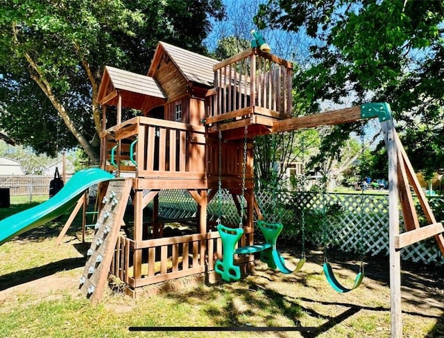 101 Byrne St, Smithville, TX 78957 - view of playground featuring fence