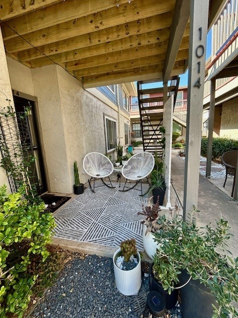 view of patio featuring stairs