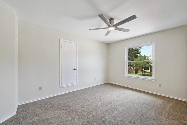 1605 Woods Blvd, Round Rock, TX 78681 - empty room with ceiling fan and carpet flooring