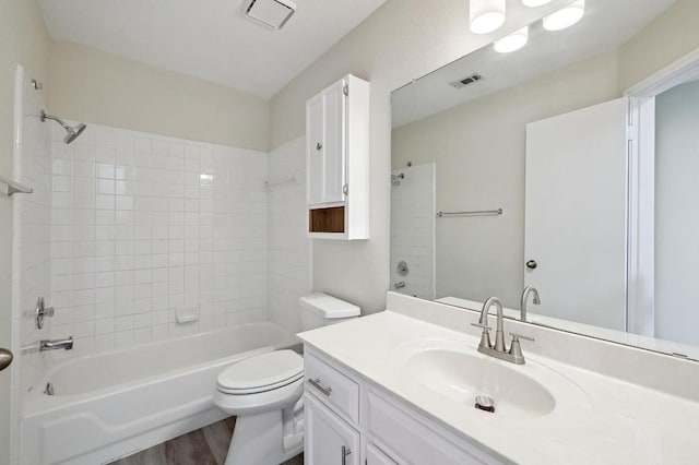 1605 Woods Blvd, Round Rock, TX 78681 - bathroom with toilet, wood finished floors, shower / bathtub combination, and vanity
