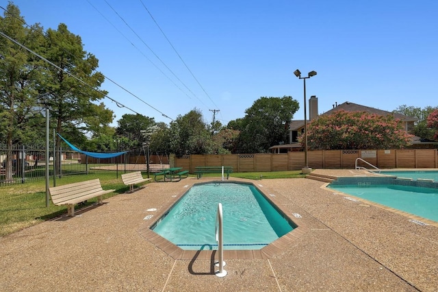 1605 Woods Blvd, Round Rock, TX 78681 - view of swimming pool with a fenced backyard and a patio area