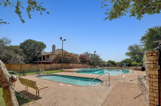 1605 Woods Blvd, Round Rock, TX 78681 - community pool featuring fence and a patio area