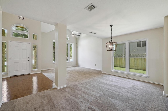 1605 Woods Blvd, Round Rock, TX 78681 - carpeted entryway with baseboards, a ceiling fan, and a chandelier