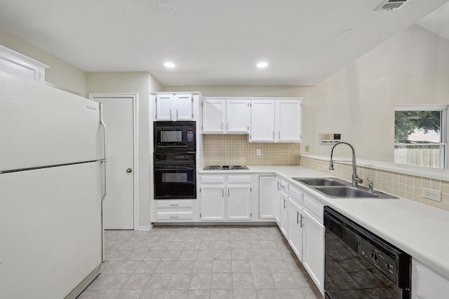 1605 Woods Blvd, Round Rock, TX 78681 - kitchen with black appliances, a sink, light countertops, tasteful backsplash, and white cabinets