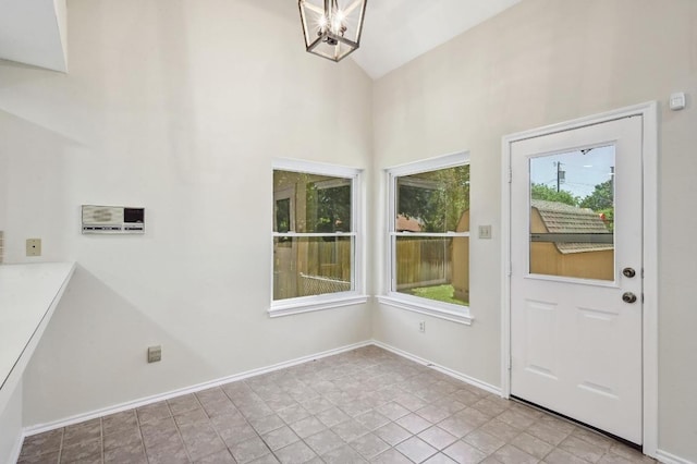 1605 Woods Blvd, Round Rock, TX 78681 - entryway with healthy amount of natural light, high vaulted ceiling, a chandelier, and baseboards