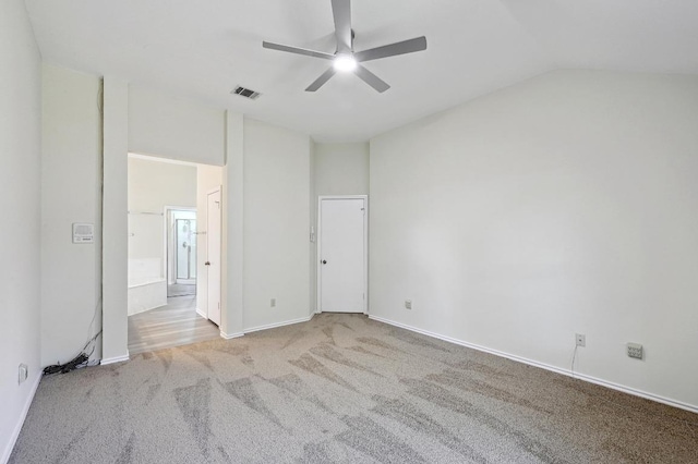 1605 Woods Blvd, Round Rock, TX 78681 - unfurnished bedroom featuring carpet floors, lofted ceiling, connected bathroom, and ceiling fan