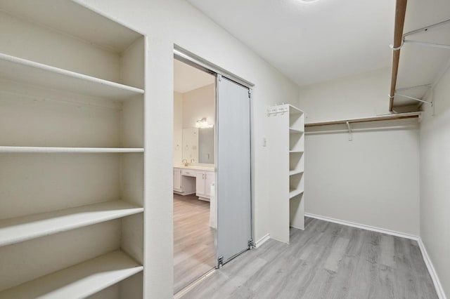 1605 Woods Blvd, Round Rock, TX 78681 - spacious closet featuring wood finished floors