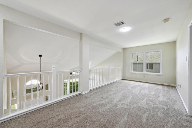 1605 Woods Blvd, Round Rock, TX 78681 - carpeted spare room featuring vaulted ceiling and a smoke detector
