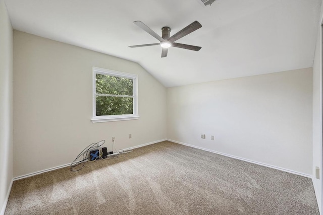 1605 Woods Blvd, Round Rock, TX 78681 - spare room featuring a ceiling fan, vaulted ceiling, and carpet