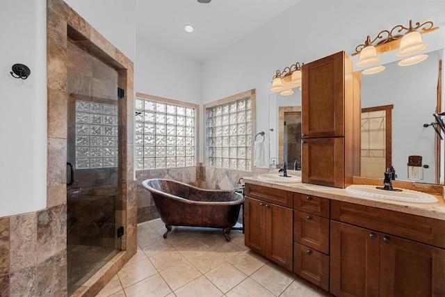 611 Post Oak Dr, Dripping Springs, TX 78620 - bathroom with tile patterned floors, a stall shower, double vanity, and a soaking tub