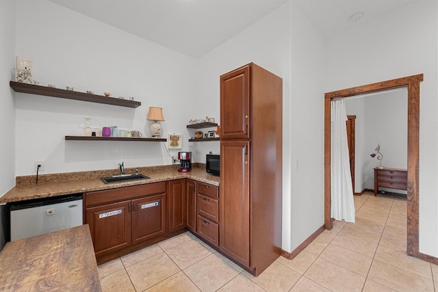 611 Post Oak Dr, Dripping Springs, TX 78620 - kitchen with a sink, open shelves, dishwashing machine, black microwave, and light tile patterned flooring