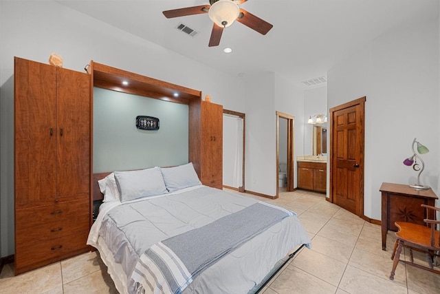 611 Post Oak Dr, Dripping Springs, TX 78620 - bedroom with light tile patterned flooring, a sink, baseboards, ensuite bath, and ceiling fan