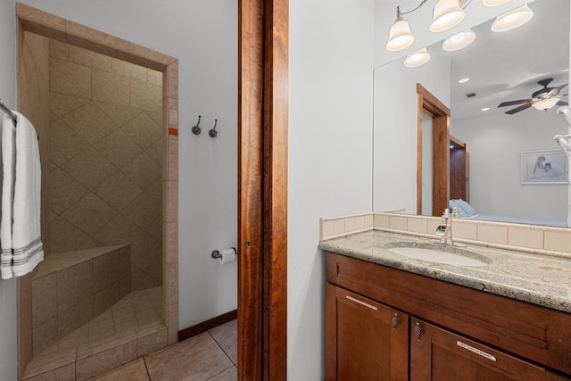 611 Post Oak Dr, Dripping Springs, TX 78620 - bathroom featuring tile patterned floors, vanity, a ceiling fan, tiled shower, and recessed lighting