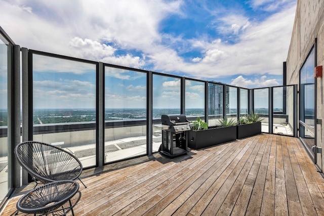 wooden deck with a grill