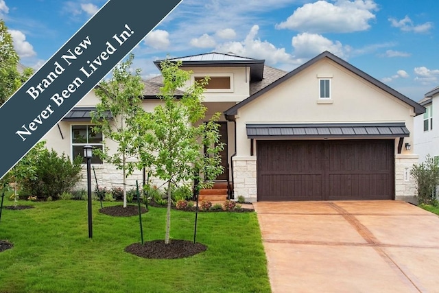 422 Sitlington Ln, Austin, TX 78738 - view of front facade with stucco siding, stone siding, a front yard, concrete driveway, and an attached garage