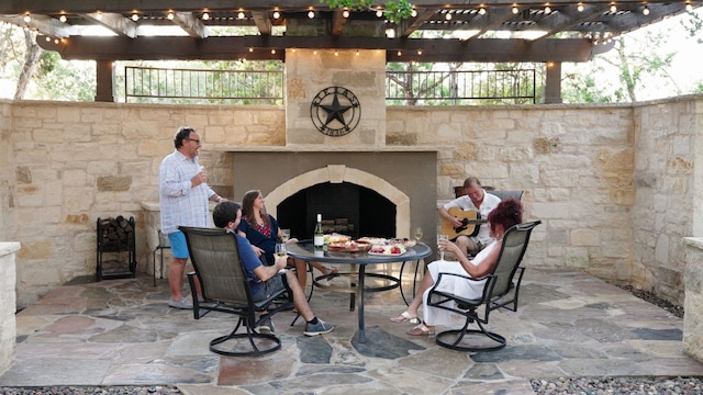 11949 Overlook Pass, Austin, TX 78738 - view of patio featuring an outdoor stone fireplace and a pergola